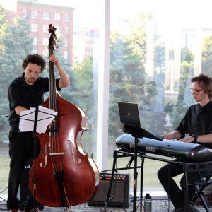 Student musicians entertain summer institute attendees during the welcome reception.