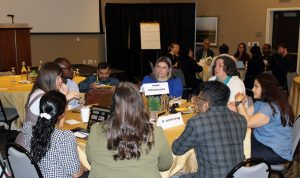 Students and faculty discuss research.