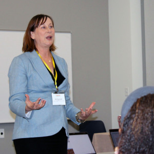 Ann Searight speaks at a session on addressing polarization. Co-facilitator Palma Strand looks on.