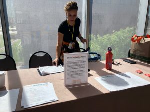 CJC Event Manager Jessica Osegueda prepares the registration table.