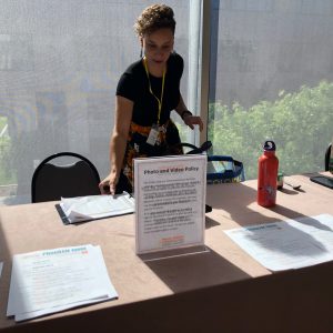 CJC Event Manager Jessica Osegueda prepares the registration table.
