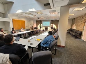 Attendees at a session on the intersection of public interest communications and rhetoric.