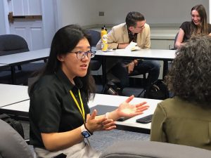 Attendee Wan Zheng speaks during a session.