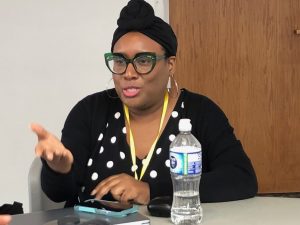 Facilitator Yewande Addie speaks during a session about persuasion and public interest communications.